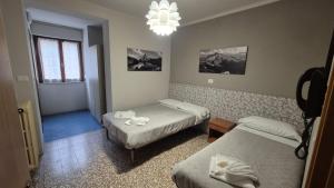 Postel nebo postele na pokoji v ubytování Albergo Valentini