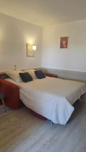 a bedroom with a large bed with two pillows on it at St RAPHAEL VALESCURE CASA in Saint-Raphaël +15 photos