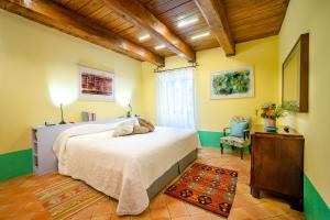 Posteľ alebo postele v izbe v ubytovaní Castello Di Postignano Relais