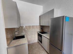 Kuchyňa alebo kuchynka v ubytovaní Eva Apartment 2