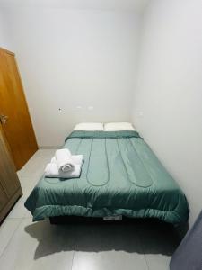 Postel nebo postele na pokoji v ubytování Residencial Yama