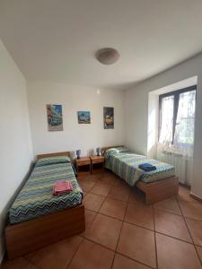 Postel nebo postele na pokoji v ubytování Il piccolo giardino