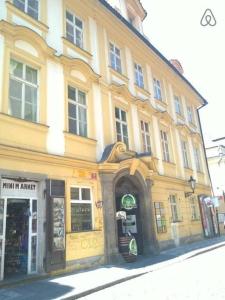 a large building on a city street with a store at 3 min Walk Old Town Center private room A in Prague