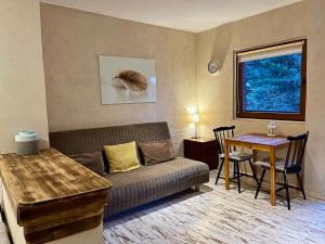 a living room with a couch and a table at Willa Avita in Karpacz +49 photos