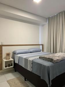 Postel nebo postele na pokoji v ubytování Apartamento Completo, Moderno e Bem Localizado + 18 fotografií