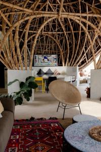 a living room with a couch and a table at Bandido Bali in Uluwatu
