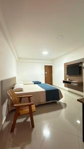 Postel nebo postele na pokoji v ubytování Hotel Skalla - MELHOR CUSTO BENEFICIO