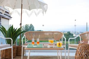 a table with glasses of orange juice on a patio at Royal House in Santa Maria La Carità
