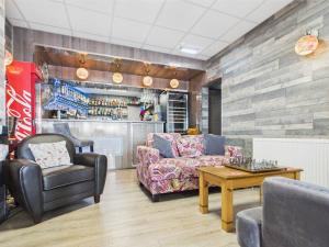 a living room with a couch and a table at Kings Boutique Hotel in Blackpool