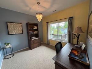 a home office with a desk and a window at A House On Catalina in Tigard