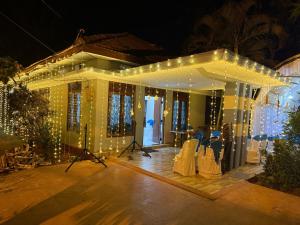 a house with lights on the outside of it at Yarl Nest in Jaffna