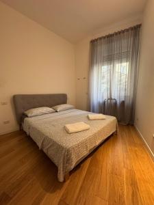 En eller flere senge i et værelse på Luxury San Babila Apartment