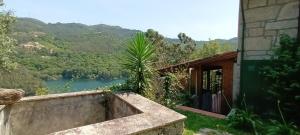 a building with a view of a river at Casa do Cadaval in Rio Caldo