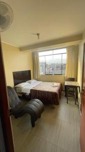 Katil atau katil-katil dalam bilik di Hostal El Encanto