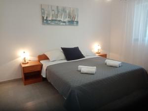 Postel nebo postele na pokoji v ubytování Apartments Marina