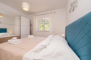 Posteľ alebo postele v izbe v ubytovaní Apartment for 4 persons, by the sea and with beautiful view