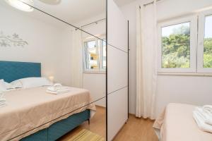 Posteľ alebo postele v izbe v ubytovaní Apartment for 4 persons, by the sea and with beautiful view