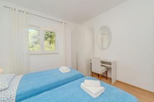 Posteľ alebo postele v izbe v ubytovaní Apartment for 4 persons, by the sea and with beautiful view