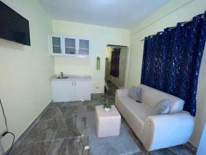 a living room with a couch and a sink at New hotel neo in Santa Cruz de Barahona +12 photos