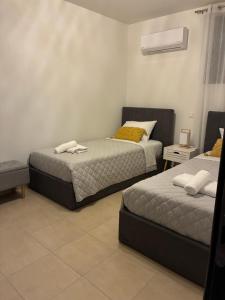 Postel nebo postele na pokoji v ubytování Angela House