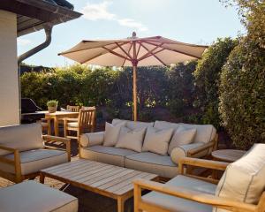 Posezení v ubytování Watthus Morsum mit Kamin und traumhaftem Garten + 37 fotografií