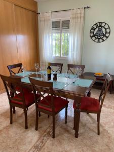 a dining room with a table with wine glasses on it at Cortijo Estrella in Serón
