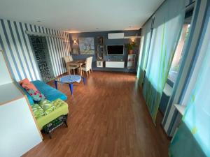 a living room with a couch and a table at Ilonas Home in Baden-Baden +9 photos