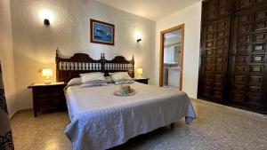 a bedroom with a bed with a plate on it at Elisabeth's Tower House in Denia +34 photos
