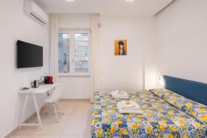 Postel nebo postele na pokoji v ubytování Brezza di Stabia Rooms
