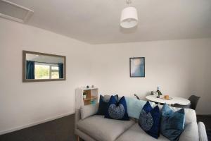 a living room with a couch and a table at 33 Beautiful 2 bed apt Tamworth Private Parking in Fazeley