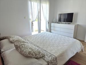 Łóżko lub łóżka w pokoju w obiekcie Deluxe Apartments Goya