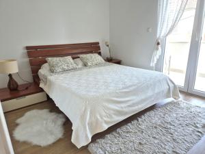 Łóżko lub łóżka w pokoju w obiekcie Deluxe Apartments Goya