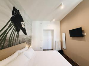 Μια τηλεόραση ή/και κέντρο ψυχαγωγίας στο Numa Bed and Breakfast +18 φωτογραφίες
