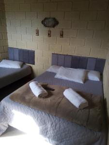 Postel nebo postele na pokoji v ubytování Chalé Pingo de Ouro Socorro SP