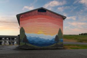 a large mural on the side of a building at Studio 6 Hickory NC in Hickory