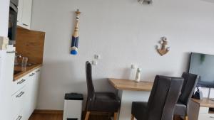 Kuchyň nebo kuchyňský kout v ubytování Optimist Sunlife Ostsee