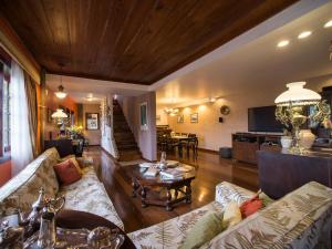 a living room with a couch and a table at O Veleiro Bed and Breakfast in Rio de Janeiro