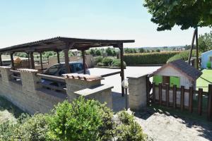 a garden with a fence and a wooden gate at Casa del Sole in Sasso