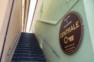 a sign on the side of a building with stairs at Rooms & Breakfast Centrale in Fabriano