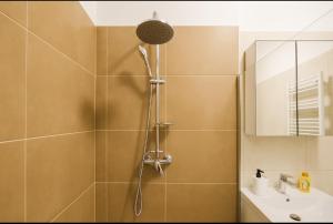 a bathroom with a shower and a sink at Marina studio in Mamaia Nord +10 photos