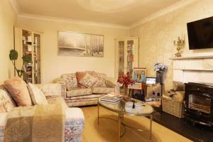a living room with a couch and a table at Fitz of Inch - Entire Venue Rental in Stradbally