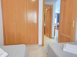 Postel nebo postele na pokoji v ubytování Acapulco 2 primera linea