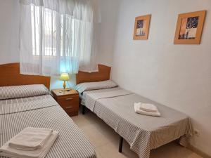 Postel nebo postele na pokoji v ubytování Acapulco 2 primera linea + 12 fotografií