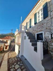 a stairway leading up to a building at balconi 1911 - Traditional house in Ydroussa, Samos in Ydroússa +34 photos