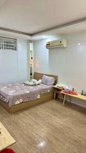 a room with a bed and a table in it at 2 floors -2 sleeps - full furniture in Da Nang