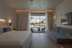 Cama ou camas em um quarto em Nuca Mykonos