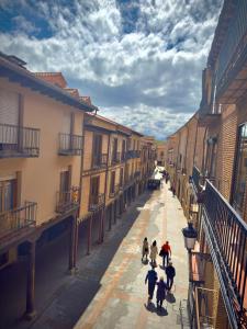 a group of people walking down a street at Roma Bella in El Burgo de Osma