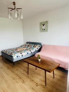 Ένα ή περισσότερα κρεβάτια σε δωμάτιο στο Žaliakalnio panoramos apartamentai