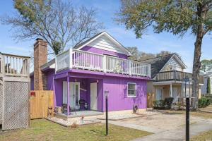 a purple house with a balcony on top of it at Mai Tu Suns - Renovated 3 Bedroom Beach Home! in Myrtle Beach