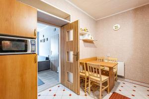 Kuchyňa alebo kuchynka v ubytovaní Apartmán u Petrů 1